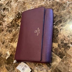 NWT kate spade Bag. Deep maroon color. Inside zippered pocket.